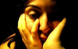 Photo of depressed woman.